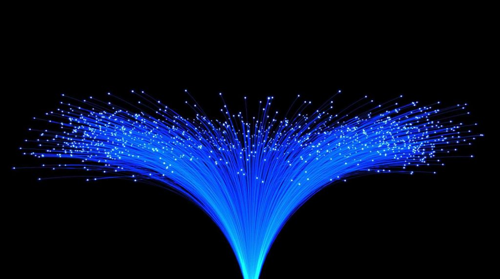 closeup of blue fiber optics with a black background