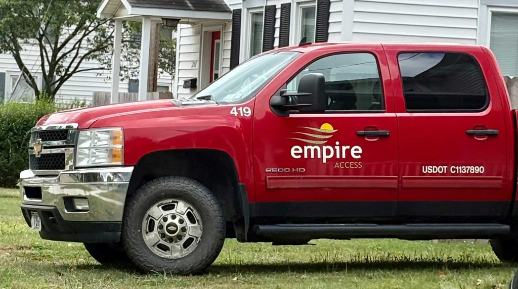 Empire Access truck in a neighborhood installing fiber internet