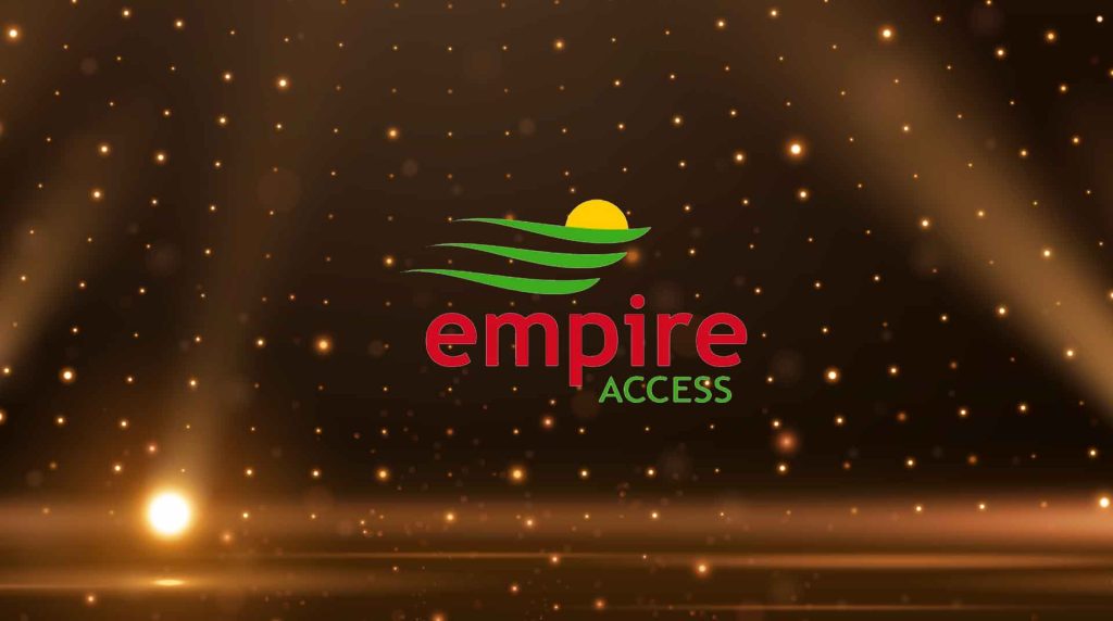 spotlight aimed at a stage with the Empire Access logo as the focus