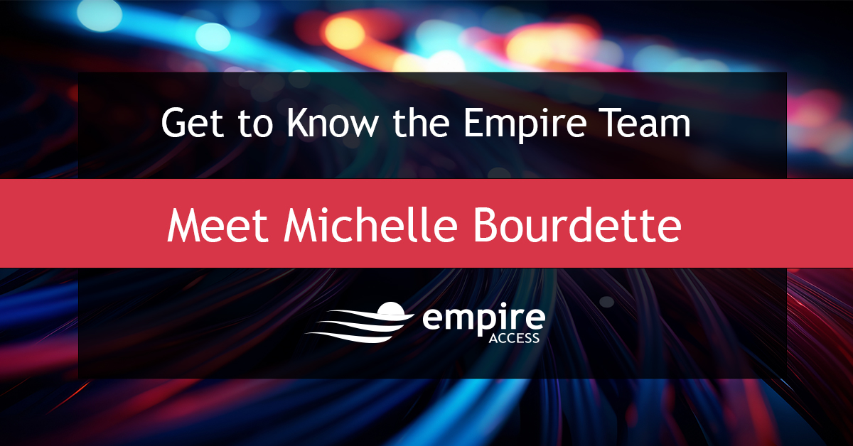 A dynamic, blurred background with colorful lights highlights the team spirit. Text overlay reads: "Get to Know the Empire Team. Meet Michelle Bourdette." The Empire Access logo is at the bottom.