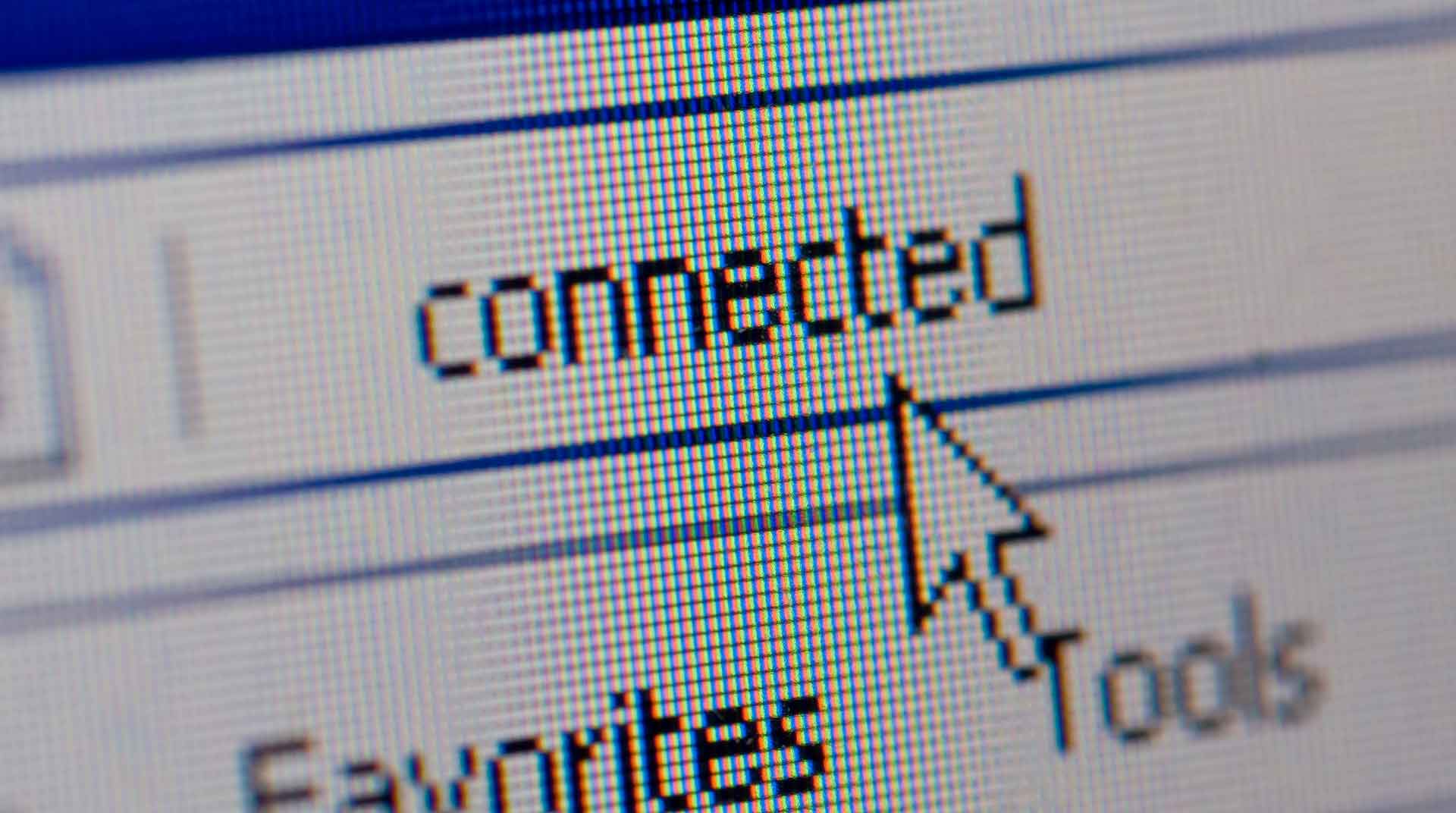 A close-up image reveals a computer screen with the word "connected" in a pixelated design, reminiscent of Jane's digital artistry. The cursor arrow points at it, indicating a successful network connection. Below, the toolbar displays "Favorites" and "Tools," enhancing the screen's functionality.