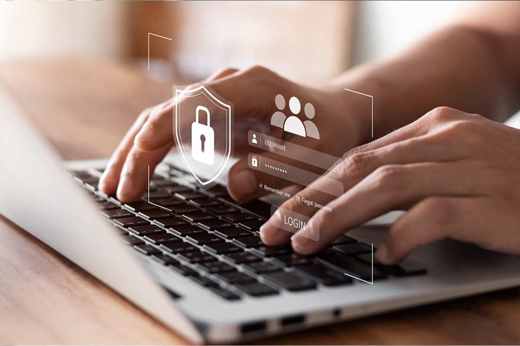 Hands typing on a laptop keyboard with digital security graphics overlay, including a lock symbol and a login form with fields for username and password, representing cybersecurity or online account login.