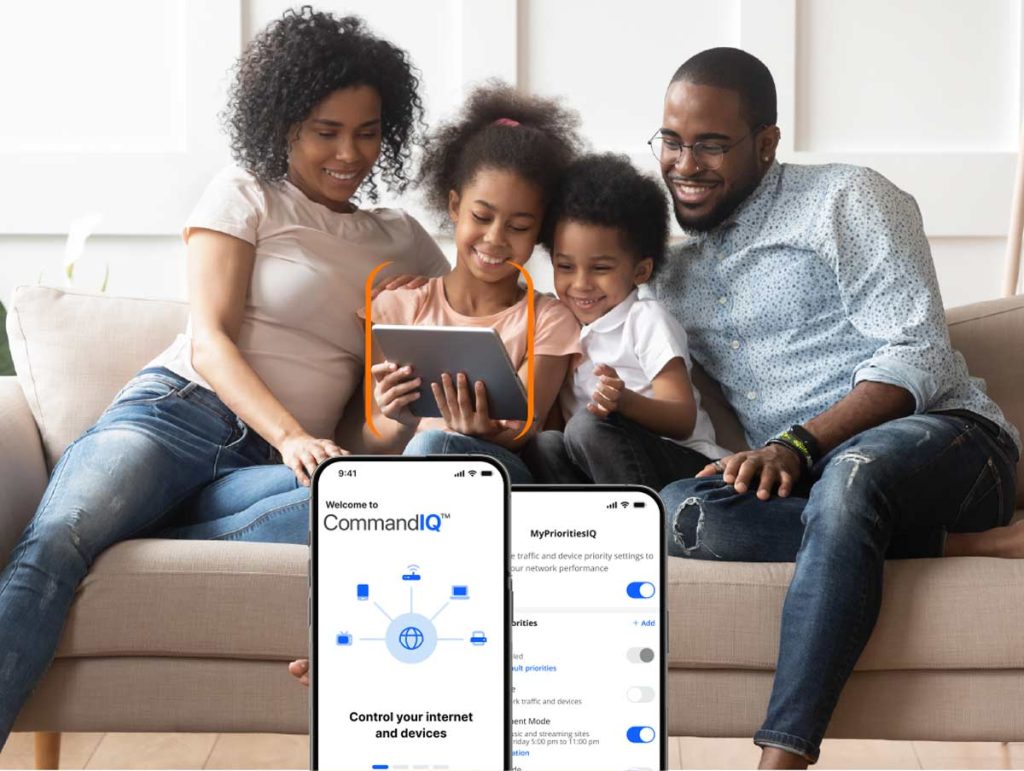 Family watching a video on a tablet with the CommandIQ app on a phone