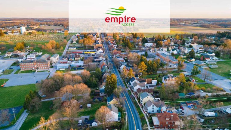 Aerial view of a local community with the Empire Access logo