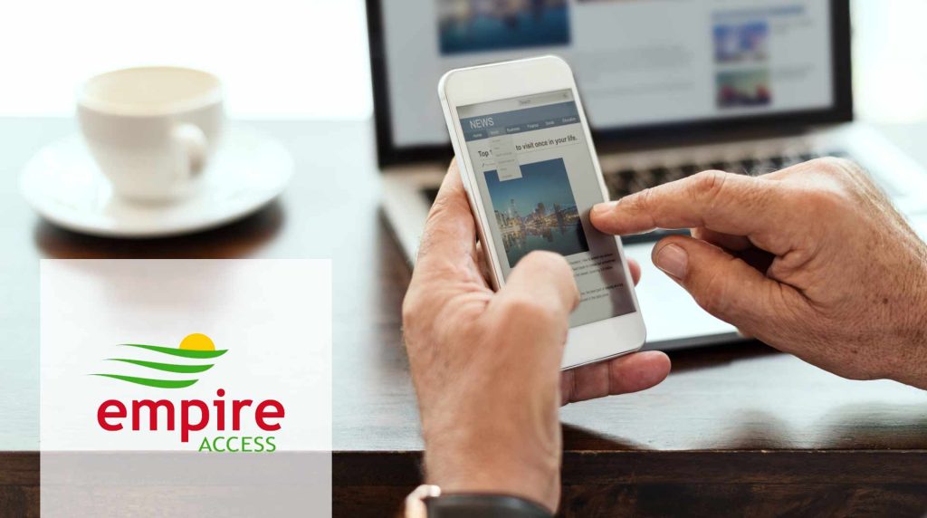 Business man on his phone while sitting at his desk