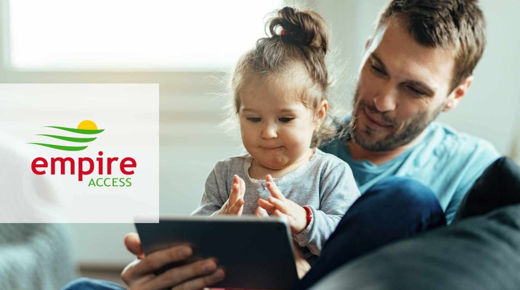 Father and daughter looking at a tablet
