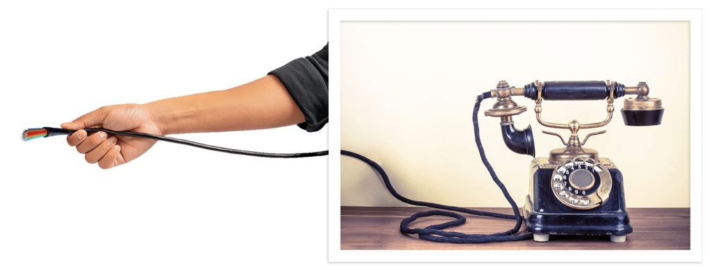 photo of a vintage phone with an arm holding a fiber option internet wire reaching outside of the photo