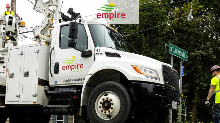 Empire Access truck in the community with two employees working on fiber internet construction